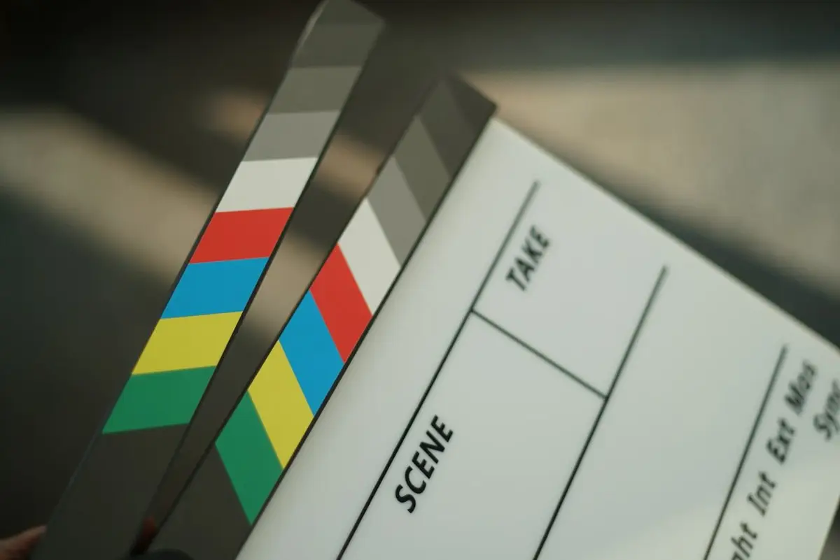 A colour-striped clapperboard, close up